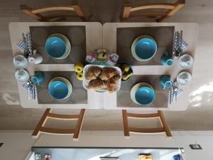 an overhead view of a toy house with blue eggs at L'AF ROOMS in Favara