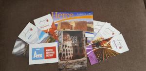 a pile of magazines and books on a table at Apartamentos Miradores del Isasa in Herce