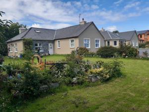 a house with a garden in front of it at Killilagh House Accommodation in Doolin