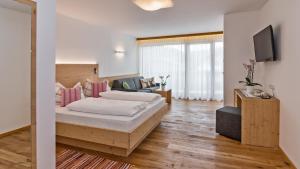 Postel nebo postele na pokoji v ubytování Hotel Moritz
