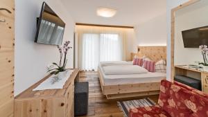 Postel nebo postele na pokoji v ubytování Hotel Moritz