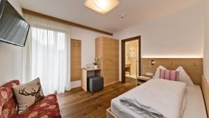 Postel nebo postele na pokoji v ubytování Hotel Moritz