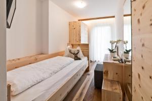 Postel nebo postele na pokoji v ubytování Hotel Moritz