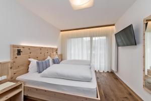 Postel nebo postele na pokoji v ubytování Hotel Moritz