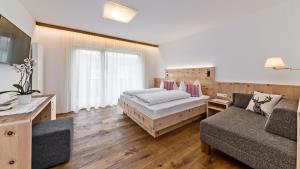 Postel nebo postele na pokoji v ubytování Hotel Moritz