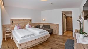 Postel nebo postele na pokoji v ubytování Hotel Moritz