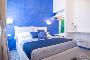 Postel nebo postele na pokoji v ubytování Valle d'Amalfi Suites + 37 fotografií