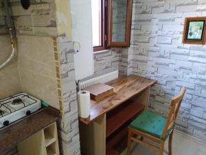 a small kitchen with a table and a chair at retro & wood in Istanbul