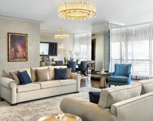 a living room with couches and a dining room at Barceló Istanbul in Istanbul
