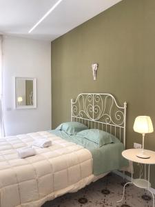 Postel nebo postele na pokoji v ubytování Maria Maddalena Holiday House