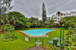 an image of a swimming pool in a yard at 207 La Ballito-Luxury Family apartment in Ballito
