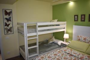 a bedroom with two bunk beds and a bed at VILLA GARDEN in Tarragona