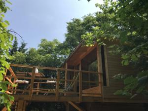 a tree house under construction with a deck at Mohatetős Lombház in Üröm