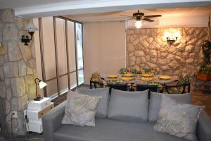a living room with a couch and a table at VILLA GARDEN in Tarragona