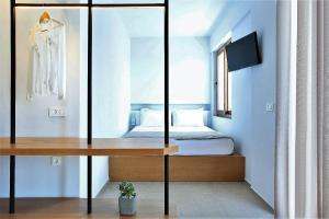 Posteľ alebo postele v izbe v ubytovaní Basilico Suites Adults Only by Estia