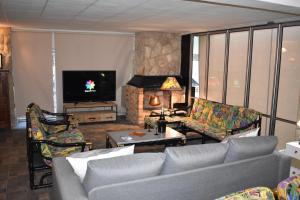 a living room with a couch and a fireplace at VILLA GARDEN in Tarragona