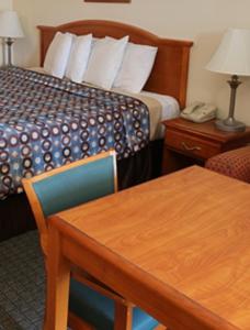 A bed or beds in a room at Express Inn & Suites Westwego