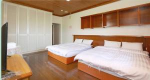 Giường trong phòng chung tại The Country B&B