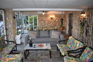 a living room with a couch and a table at VILLA GARDEN in Tarragona