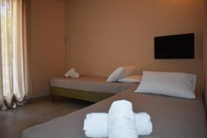 A bed or beds in a room at Korina's Apartments