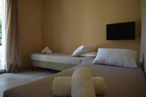 A bed or beds in a room at Korina's Apartments