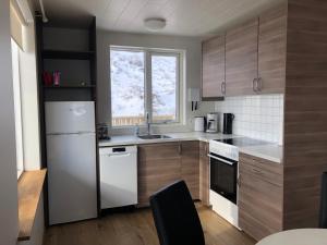 Kuchyň nebo kuchyňský kout v ubytování Mosas cottages