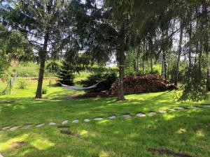 a hammock in a yard with trees and grass at Chata Prachov**** in Jičín