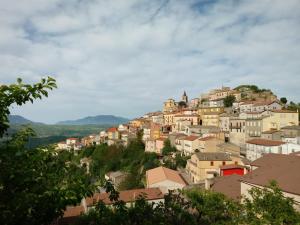 a town on a hill with houses at Le Ali del Vento in Cairano