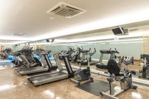 a gym with a bunch of tread machines in a room at Hotel Boa - Vista in Porto