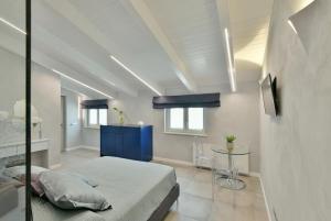 Postel nebo postele na pokoji v ubytování Amnis suites