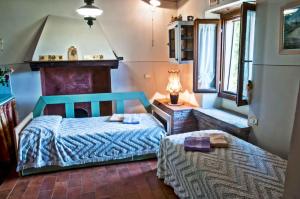 Postel nebo postele na pokoji v ubytování Agriturismo Corboli