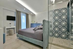 Postel nebo postele na pokoji v ubytování Amnis suites