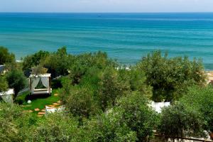 a view of the ocean from a house at Akti Hotel Kavala in Paleo Tsifliki