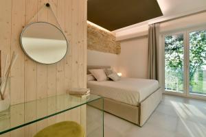 Postel nebo postele na pokoji v ubytování Amnis suites