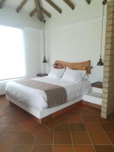 Een bed of bedden in een kamer bij Casa del Sol