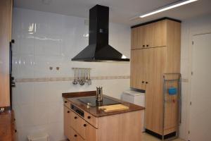 a kitchen with a sink and a stove at VILLA GARDEN in Tarragona