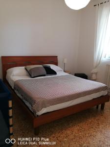 Posteľ alebo postele v izbe v ubytovaní Villa Galilei Rooms
