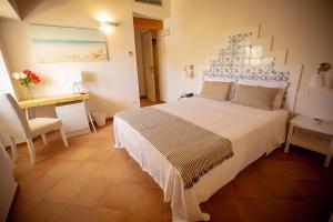 Postel nebo postele na pokoji v ubytování Casale La Macina - Hotel, Scopello