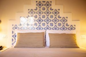 Postel nebo postele na pokoji v ubytování Casale La Macina - Hotel, Scopello