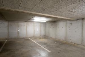 an empty room with a parking lot in a building at City-Apartment Neubaugasse - PRIVATE PARKING GARAGE in Graz