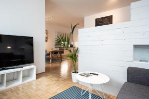 En TV eller et underholdningssystem på City-Apartment Neubaugasse