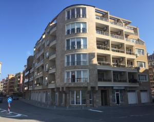 an apartment building on the corner of a street at Apartments Dione in Pomorie