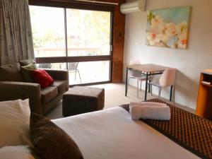 Postel nebo postele na pokoji v ubytování Motel Sierra - Bright