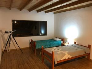 Säng eller sängar i ett rum på El damascal Paihuano