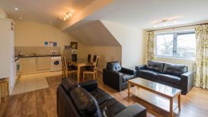 a living room with a couch and a table at The Courtyard Apartments in Carrick on Shannon