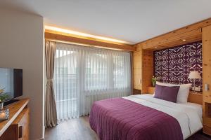 Postel nebo postele na pokoji v ubytování Le Mirabeau Resort & Spa