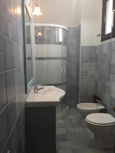 Ванна кімната в Beach House Ilaria - Turchese Apt