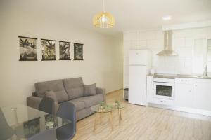 a living room with a couch and a table at Be Free Carboneras in Carboneras