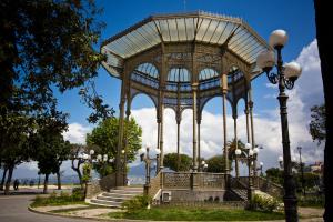 a large gazebo in a park with stairs and lights at B&B Serena in Castellammare di Stabia