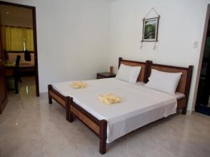 Postel nebo postele na pokoji v ubytování Alona Vida Beach Resort